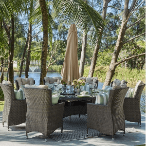 8 seat eton dining chair & table placed under coconut trees