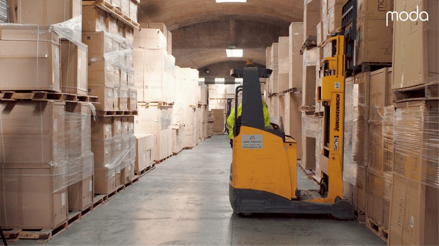 forklift truck operating inside moda warehouse